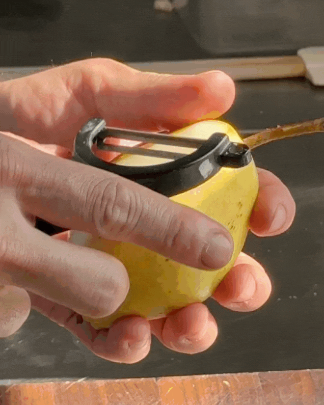 Peeling a pear at restaurant elm