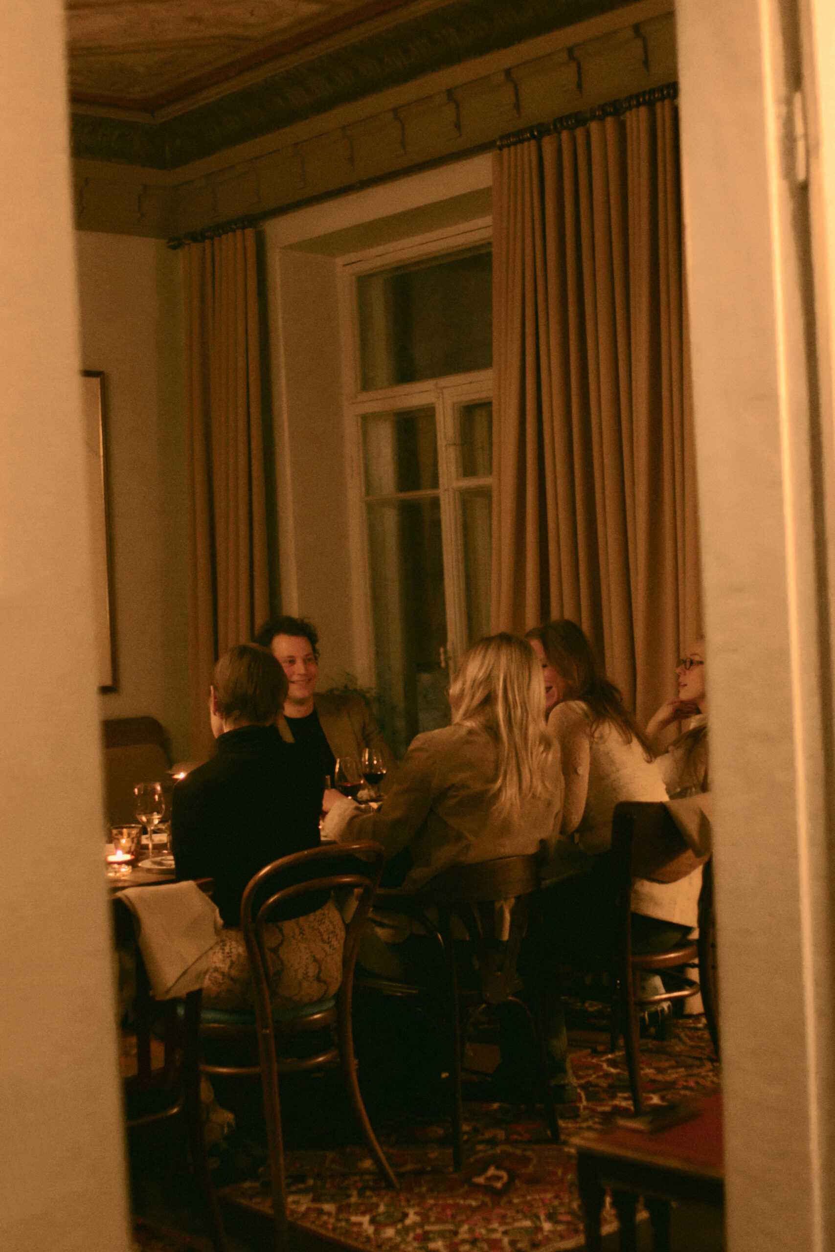 Group of people eating in Elm's dining room 
